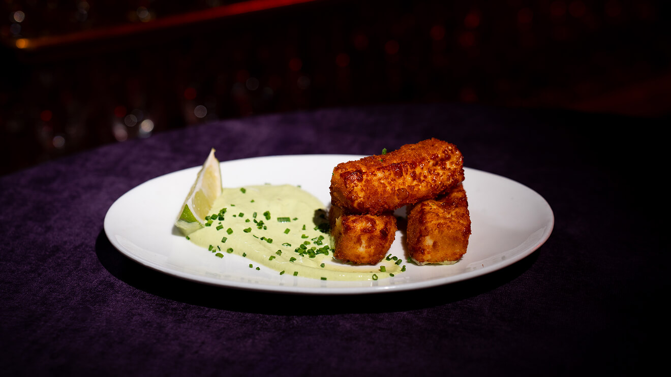 Upscale dining experience at Fabrika in Philadelphia: perfectly presented crispy appetizer with lime. A must-try characteristic of a great restaurant.